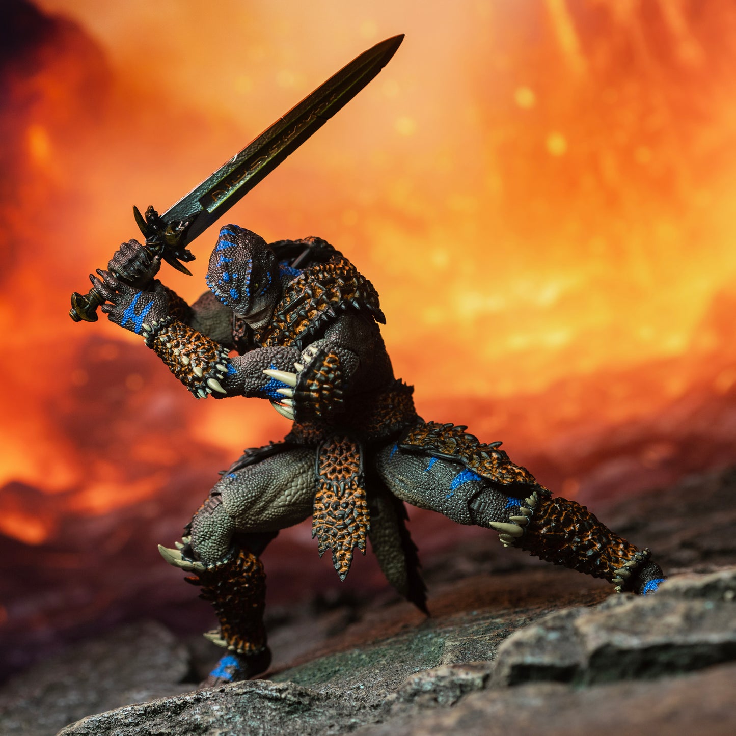 Fully armored brown Lemurian with blue striping in a wide footed action stance holding sword above right shoulder in a two-handed pose.