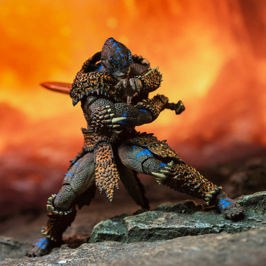 Fully armored brown Lemurian with blue striping standing beside lava flow and preparing to swing his sword across his body, from left to right.