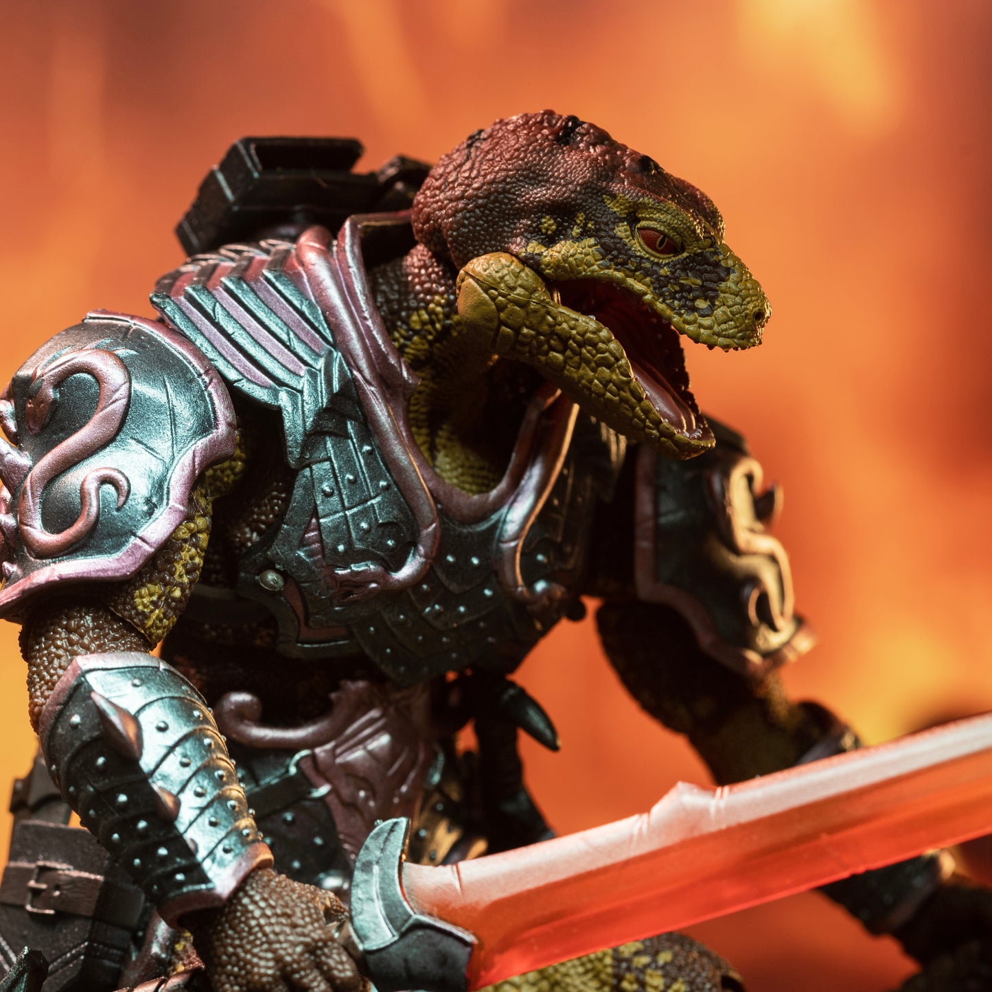 Closeup side view of fully armored brown and yellow Lemurian holding translucent-bladed sword at hip level in his right hand.