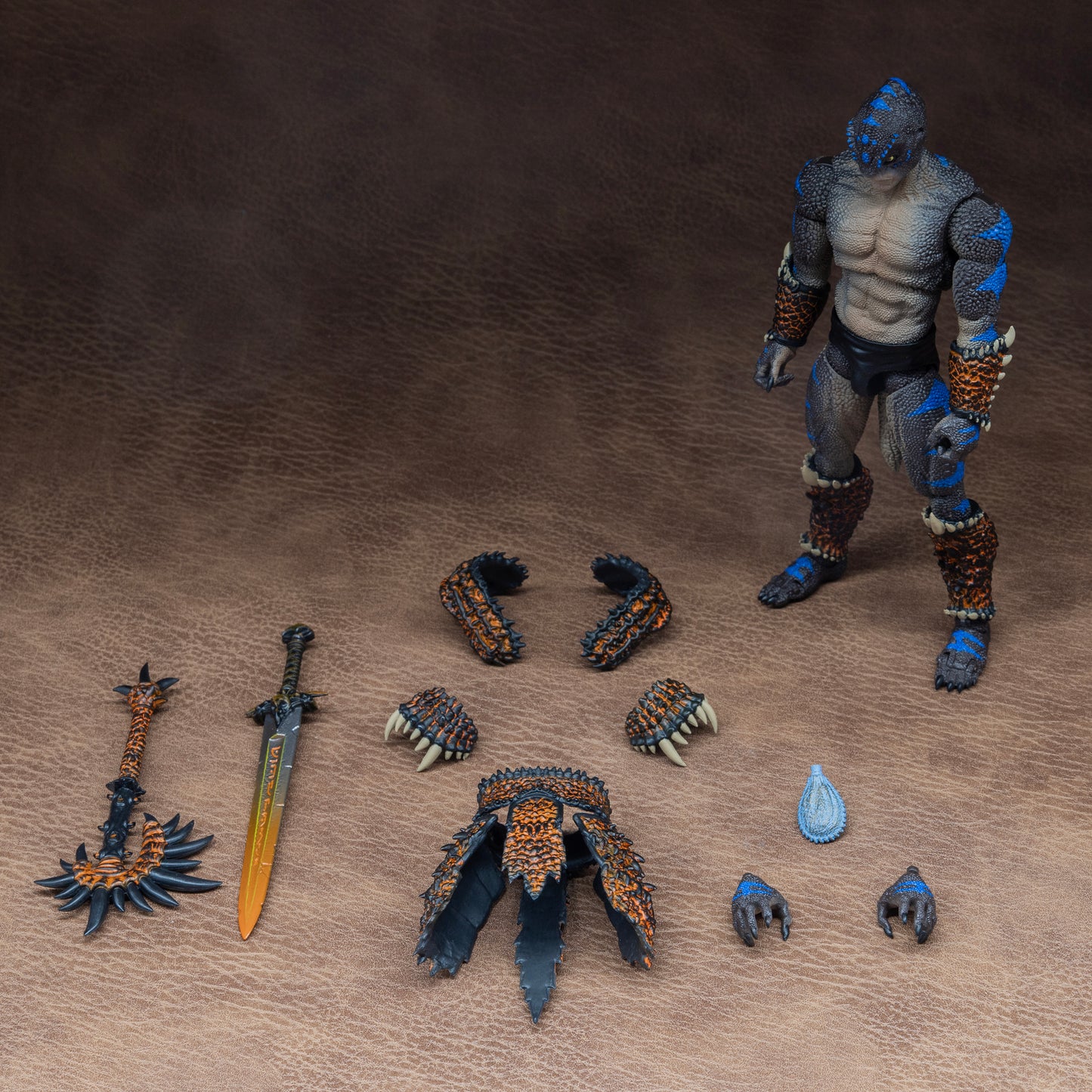 Load out image. Brown Lemurian with blue striping standing at attention beside all included accessories: Trapezius armor, shoulder armor, waist and hip armor, gripping and gesturing hands, sword, battle axe, and leather pouch belt accessory.