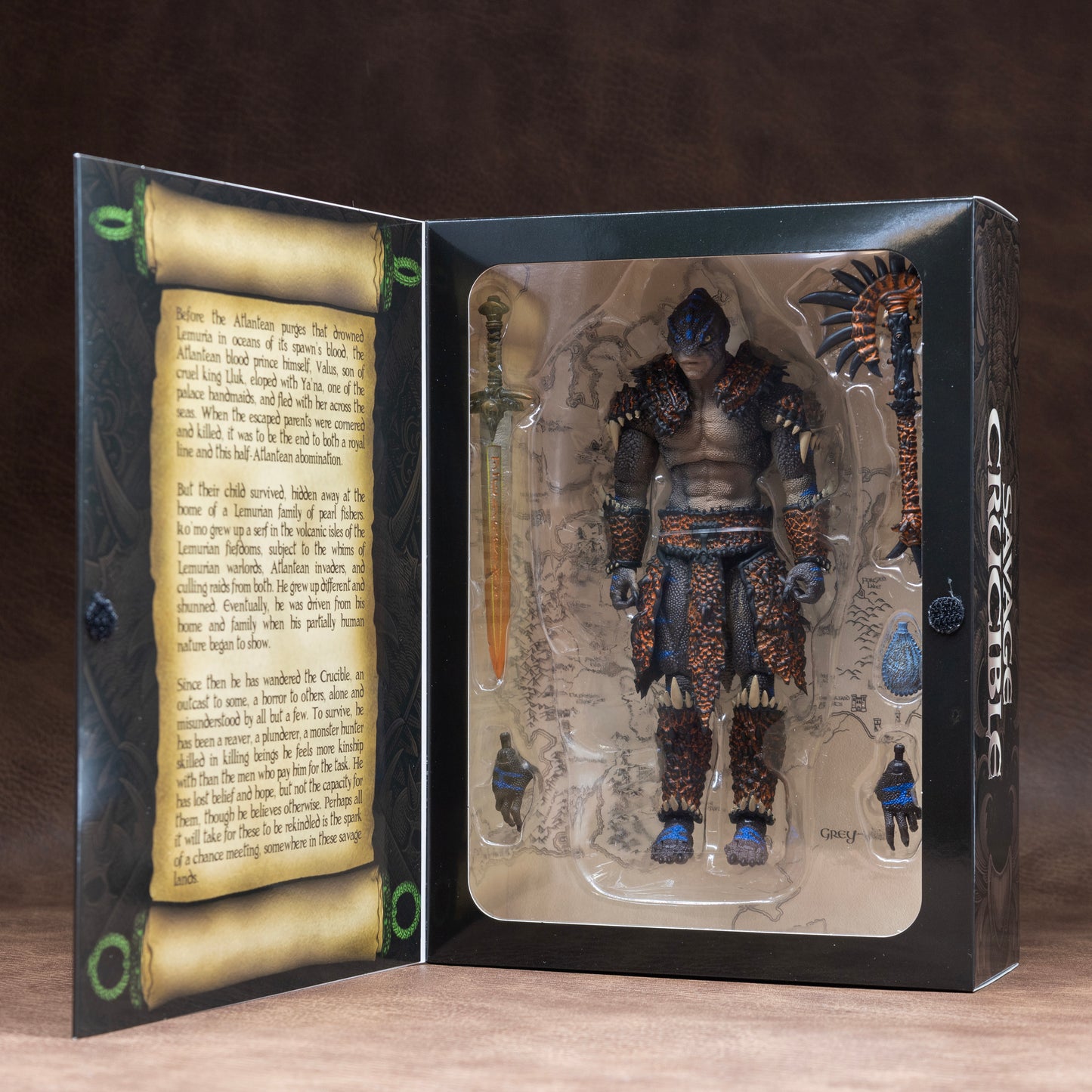 Fully armored brown Lemurian with blue striping shown in window box packaging.