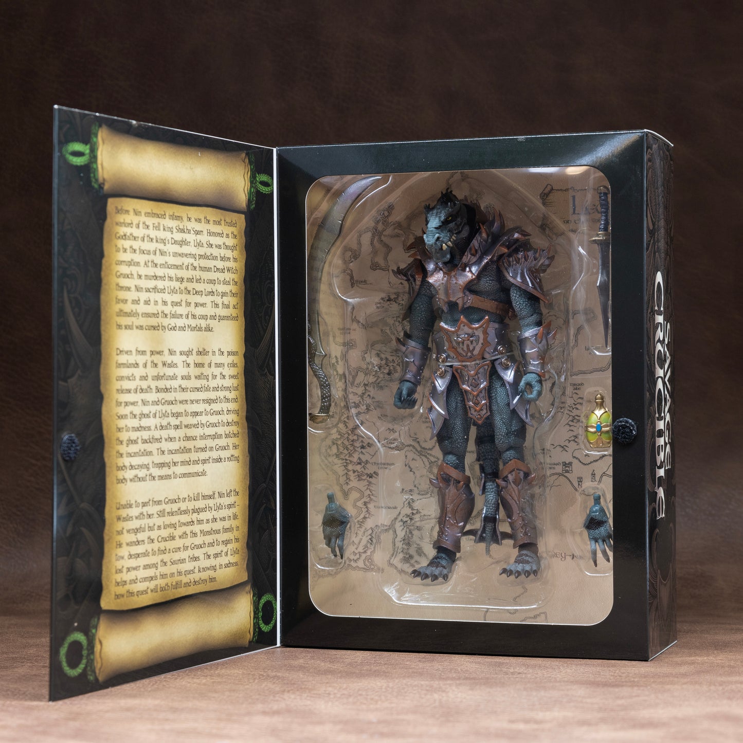 Fully armored green Saurian shown in window box packaging.