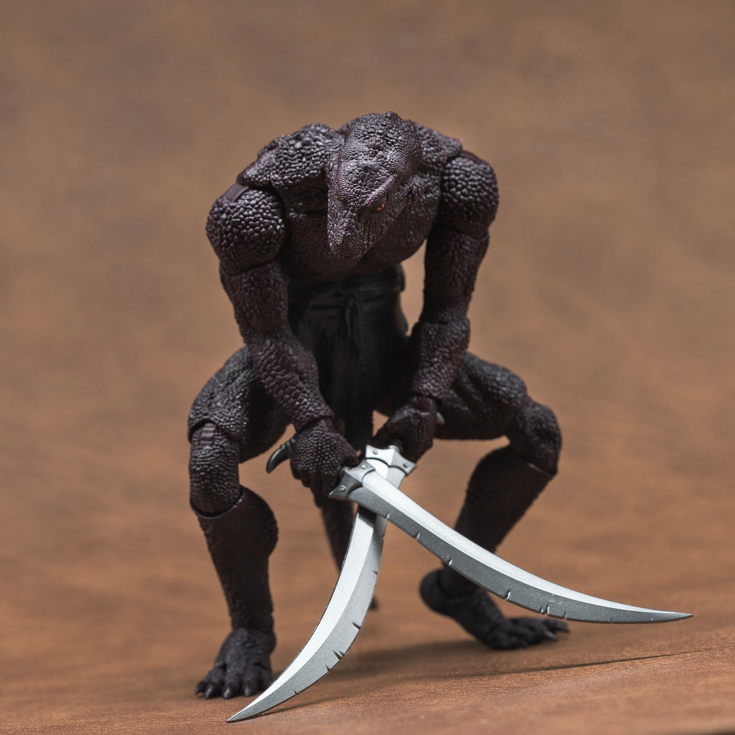 Purple Lemurian crouched low and looking sideways with two sabers held low to the floor with blades crossed.